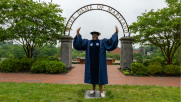 Lavorette Preston posing in front of NDMU archway
